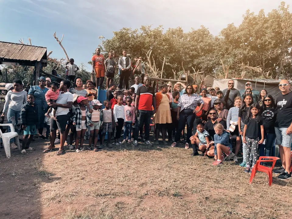 Nation Changers volunteers with children and families at a community outreach