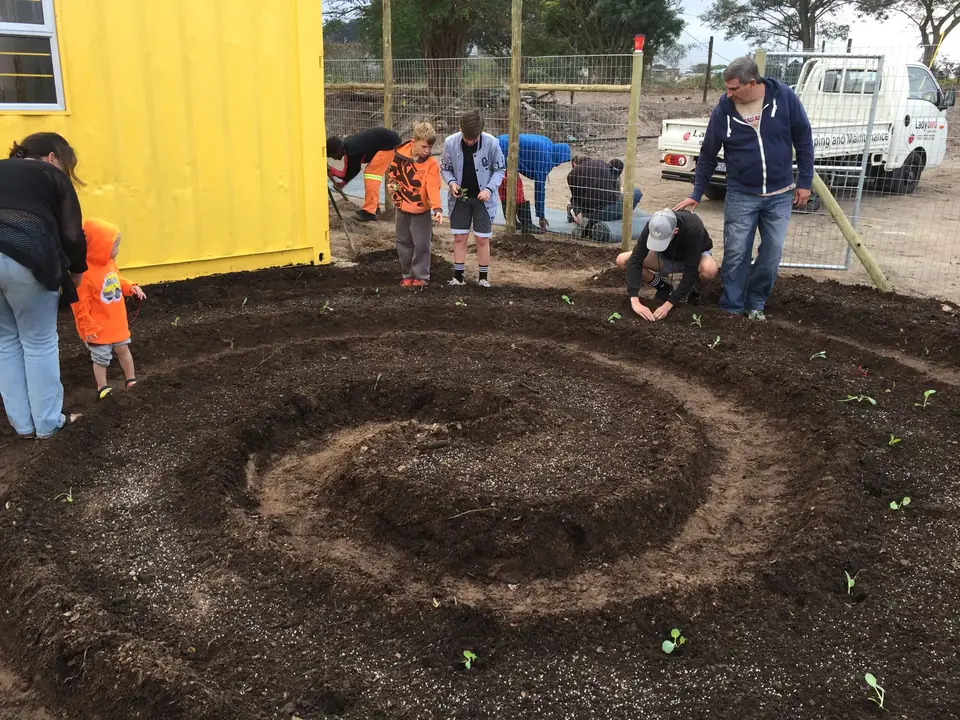 Planting a spiral vegetable garden at a creche